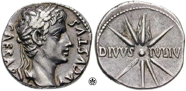 Silver coin, head of young Augustus facing right, with the words CAESAR AUGUSTUS around the edge on the obverse, comet with eight rays and tail of fire blazing upwards, with the words DIVUS IULIU going left to right straight across the center of the coin on the reverse
