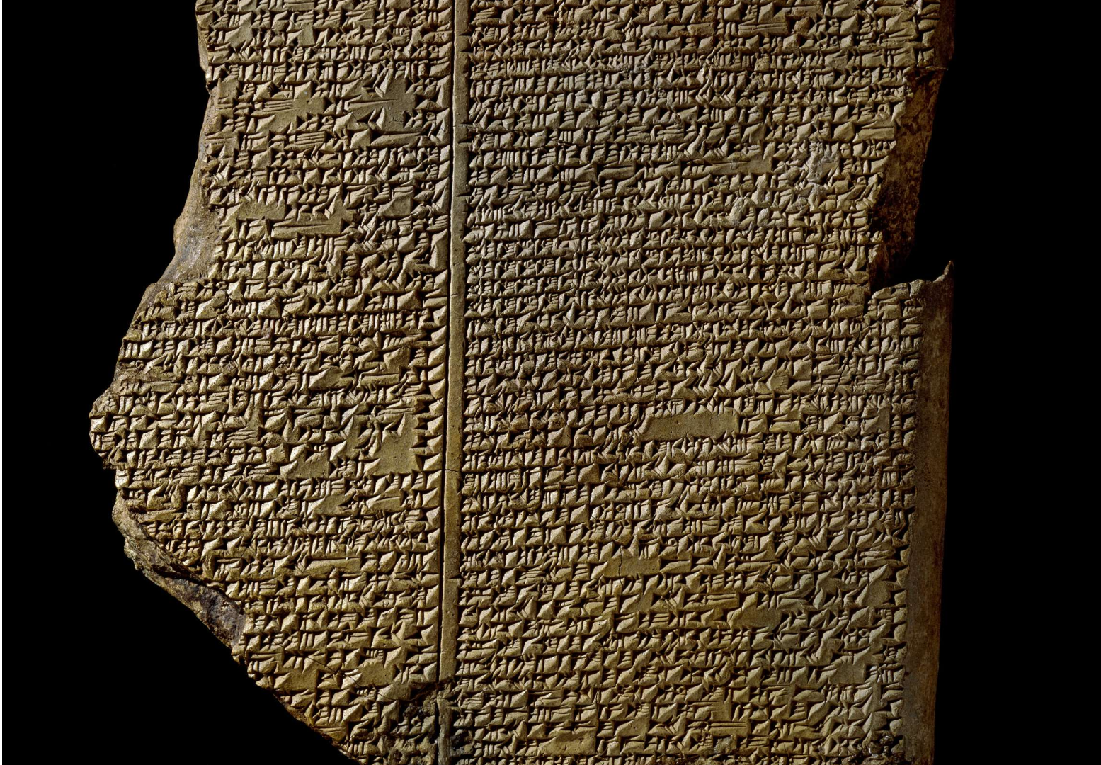 A clay tablet showing two distinct columns of cuneiform text. The edges of the tablet, particularly the left side, are broken.