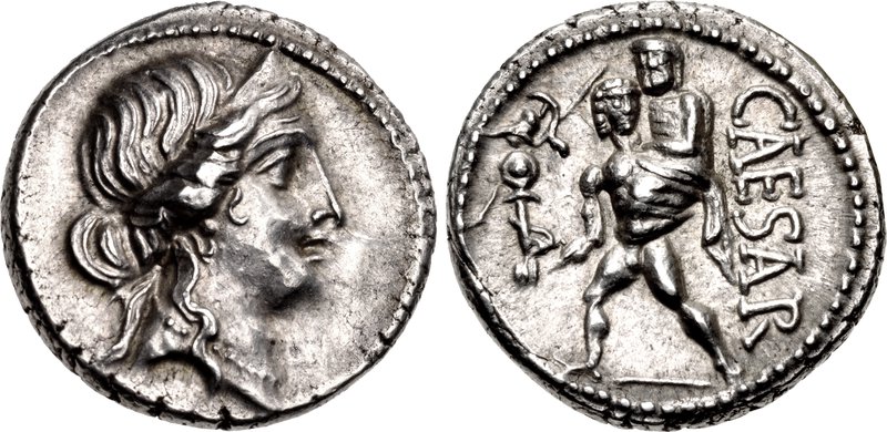 Silver coin. Obverse: Diademed head of Venus in profile, wearing necklace. Reverse: Aeneas advancing left, nude, holding father Anchises on shoulder with left hand, right hand holding small statue of Athena (the palladium). The word CAESAR in capitol Roman letters downward on right side.
