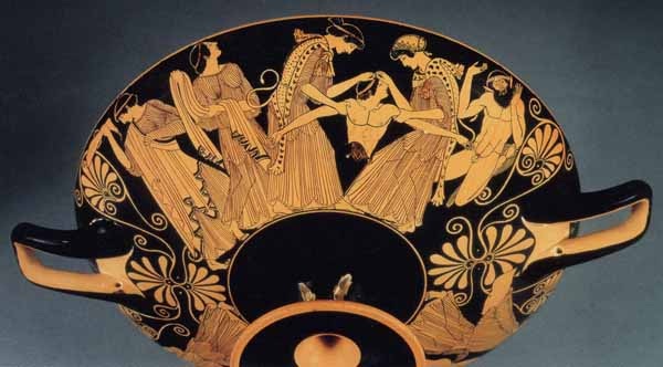 Two maenads, women dressed in leopard skins, hold the torso of Pentheus. Another maenad holds one of his detached legs, and another stands by and watches. A satyr stands watches.