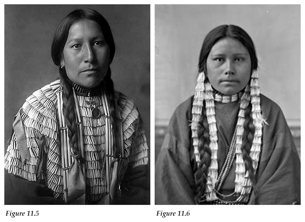 Oglala Sioux woman wearing a dress adorned with dentalium shells and woman with braided hair adorned with dentalium shells