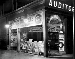 What's showing? An early cinema or nickelodeon -- so called because it cost a nickel (5 cents) to get in -- on Queen Street West in Toronto, ca. 1910. (By William James - This image is available from the City of Toronto Archives, listed under the archival citation Fonds 1244, Item 320C.This tag does not indicate the copyright status of the attached work. A normal copyright tag is still required. See Commons:Licensing for more information.Deutsch | English | suomi | français | magyar | македонски | Nederlands | português | +/−, Public Domain, https://commons.wikimedia.org/w/index.php?curid=3605209) https://en.wikipedia.org/wiki/Nickelodeon_(movie_theater)#/media/File:Auditorium_Theatre_in_Toronto.jpg