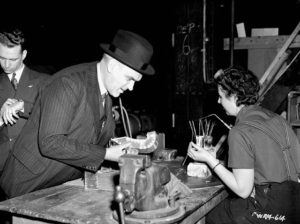 Minister of Munitions and Supply, C.D. Howe, tours an aircraft plant in 1941.