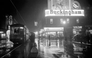 Montréal's Saint Catherine Street aglow in neon lights, ca.1937.