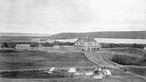 The Fort Qu'Appelle Indian Industrial School was one of the first to open. Seen here ca.1885, with teepees and carts outside the fence. (Photo by O.B. Buell. Library and Archives Canada. PA-182246) http://collectionscanada.gc.ca/pam_archives/index.php?fuseaction=genitem.displayItem&rec_nbr=3194883&lang=eng