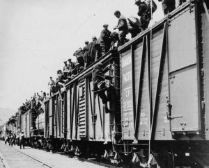 Unemployed workers board boxcars headed east from Kamloops in the On-to-Ottawa Trek, 1935. (Library and Archives Canada / C-029399)