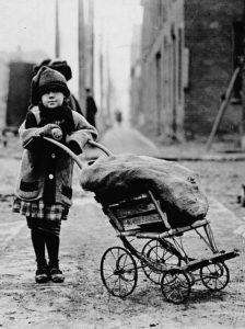 Children contributed to the household income in a variety of ways, including coalgathering, which was provided fuel and could be sold as well. A young girl in Toronto, ca.1900.