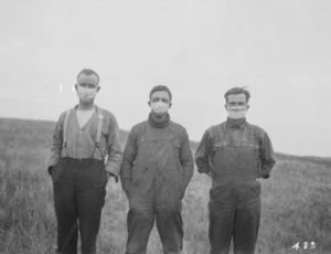 Albertan men wearing masks during the influenza epidemic, 1918.Credit: Library and Archives Canada / PA-025025