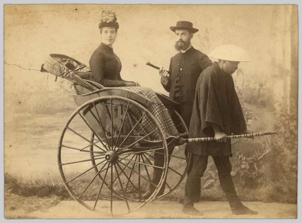 A portrait of John and Bessie Robinson (1888) by Tanaka Miyoji. Bessie is sitting in a rickshaw pulled by an unknown Japanese man.