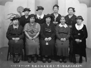 Here, seven women pose for a photo at a kanreki celebration, or sixtieth birthday of members of the Buddhist Women’s Association, in Vancouver in 1939.