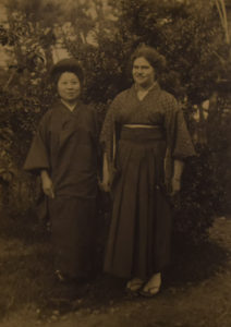 A grown Hilda Robinson, in Japanese dress, poses for a photo with a Japanese colleague of the Robinson family.