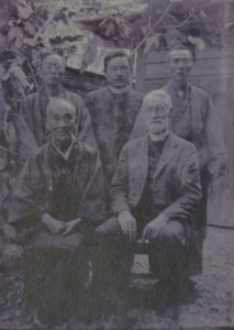 In this photo, John Cooper Robinson poses with four men who were likely Japanese Christians.