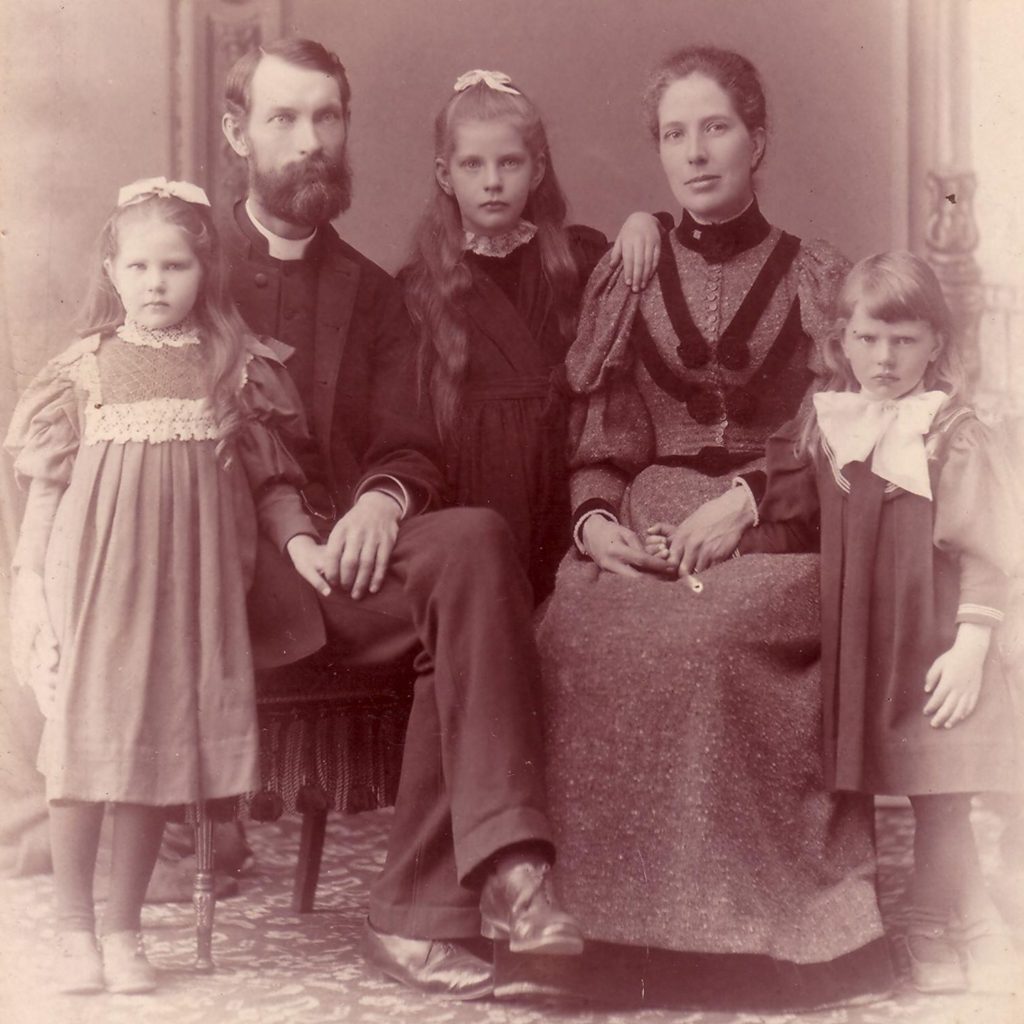 This is a portrait dating to the late 1890s, of John Cooper Robinson, his wife Bessie, and his daughters. Robinson and Bessie are seated, while the three daughters stand next to them.