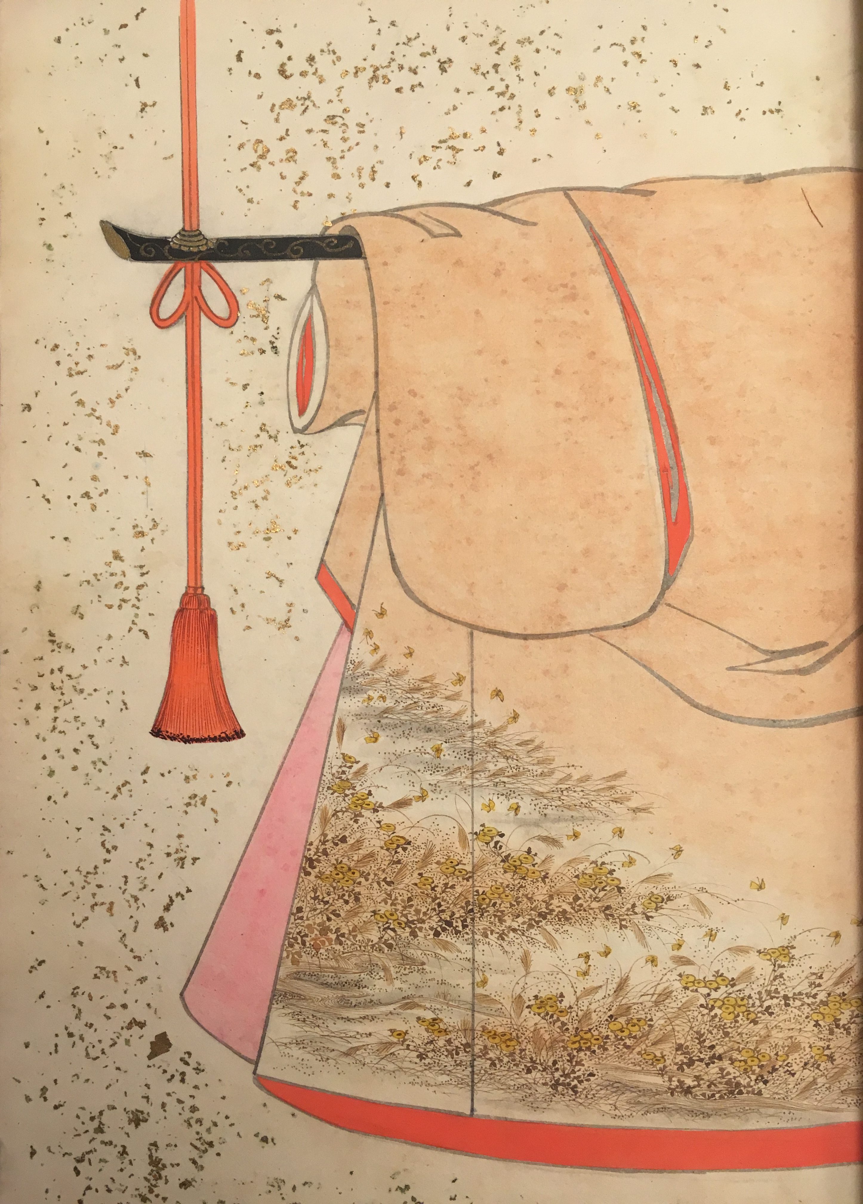 A design of a peach-colored kimono with pink and reddish interior. Japanese silver grass and chrysanthemums make up the pattern in the lower corner.