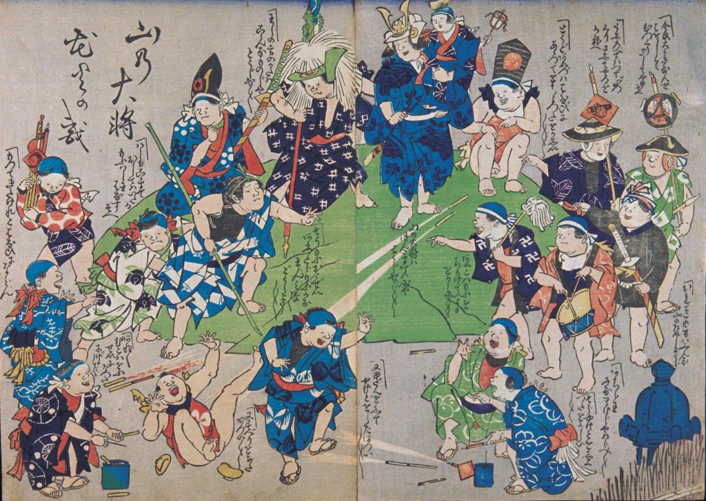 An illustration depicting a busy scene of children playing and setting off fireworks on a small hill. Many of the children have prop weapons, like wooden swords, sticks, and mops.