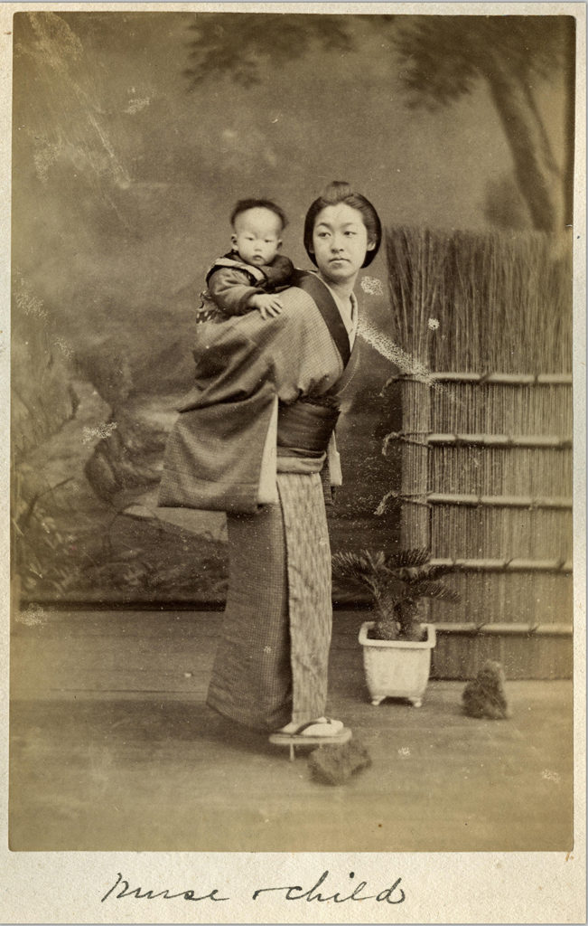 Another photo of a different Japanese nurse with a child. This photo appears to have been taken in a studio instead of outdoors.