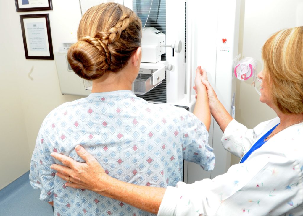 Woman reciving a mammogram