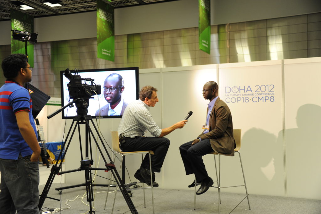 An individual being interviewed vy a reporter on tv.