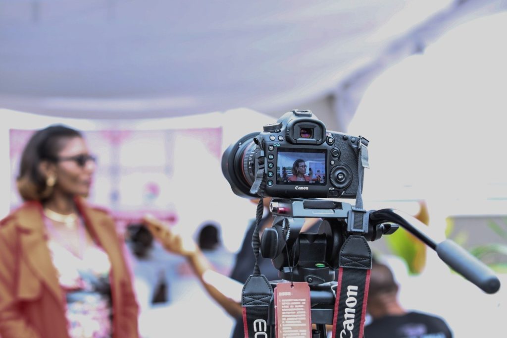 Woman speaking to a reporter on camera