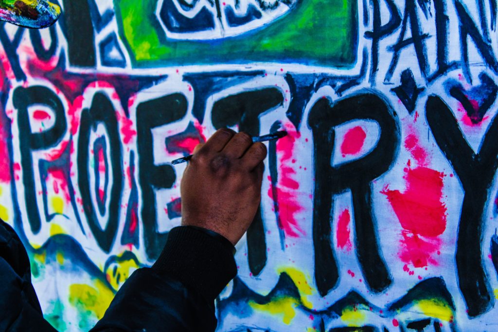 Graffiti wall with the word poetry