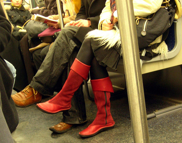 Two people sitting with their legs crossed