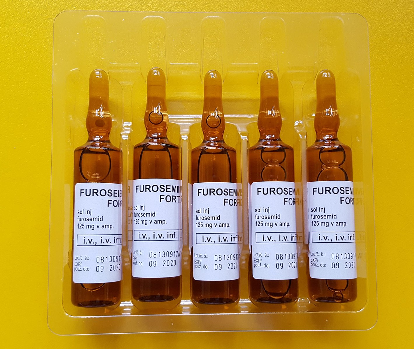 Furosemid 125mg vials yellow background.
