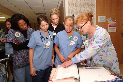 Staff nurse teaching students. Staff nurse teaching students.