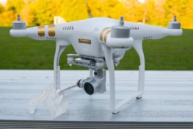 A photo of a white DJI Phantom 3 Professional UAS sitting on a table