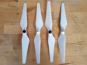 A picture showing four white propellers for the DJI Phantom 3 Professional drone
