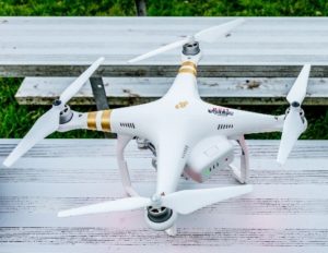 Picture showing white DJI Phantom 3 Professional with all four propellers attached to the drone