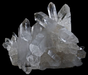 The quartz crystals poke out in multiple directions. They look like glass