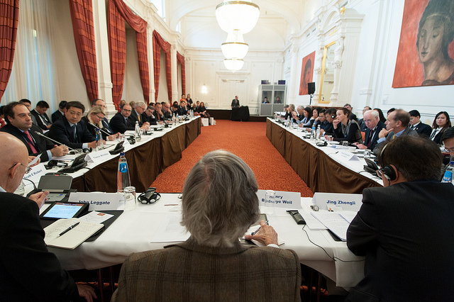 A man speaking at a business meeting