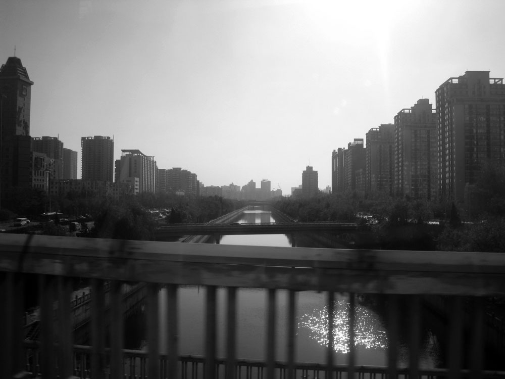 Canal with buildings on either side in Beijing China