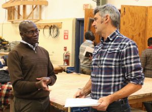 A Canadian carpentry instructor discussing teaching with Kenyan instructor