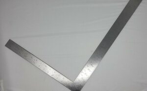 A metal ruler in the shape of an L.