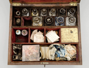 Image of tiny glass bottles in wooden case