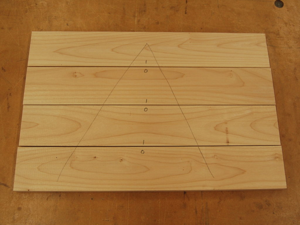 Marking up a panel for edge jointing. A V is marked on each board, with in I or O on each half of the joint.
