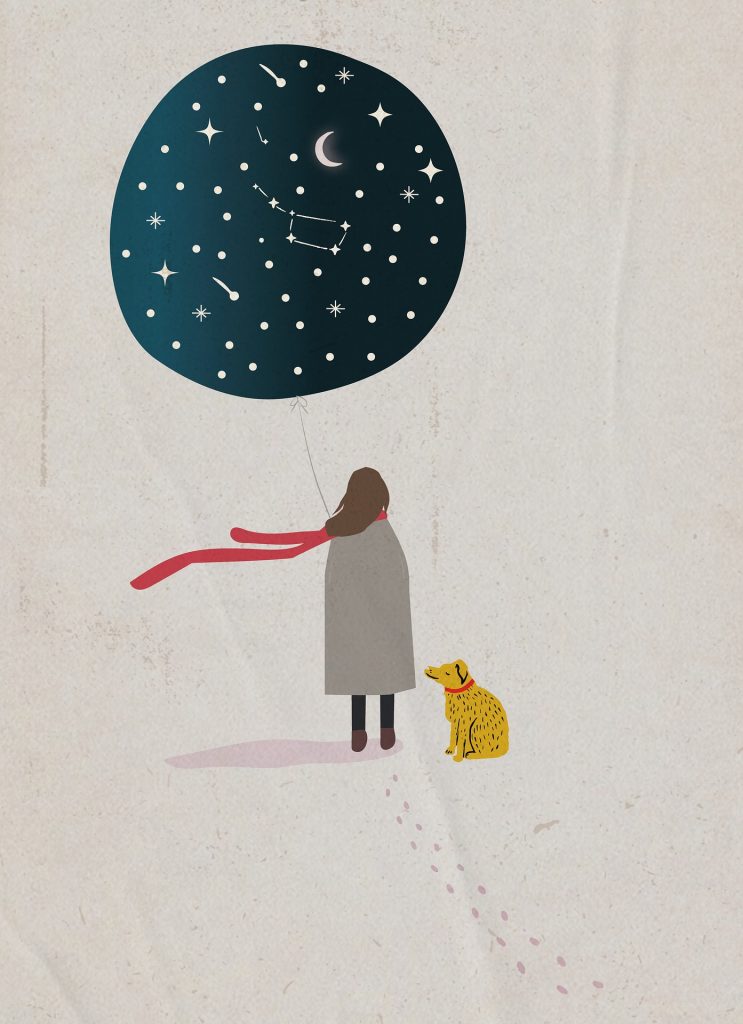 Back view of a person with long dark hair in a long grey coat and red scarf blowing in the wind standing, holding a balloon that has a starry sky design. A dog is sitting next to the person.